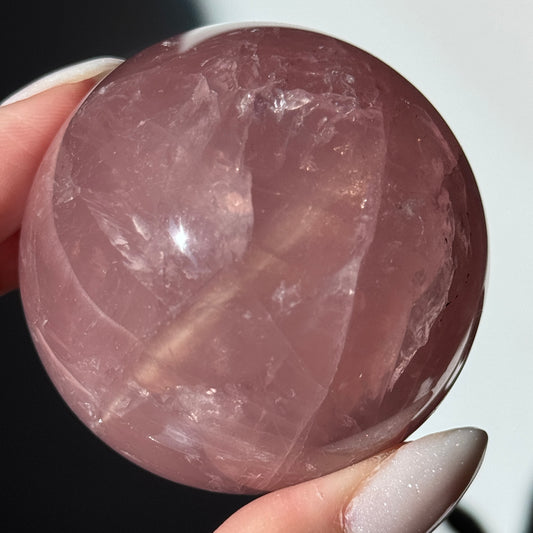 dark pink rose quartz sphere asterism crystals