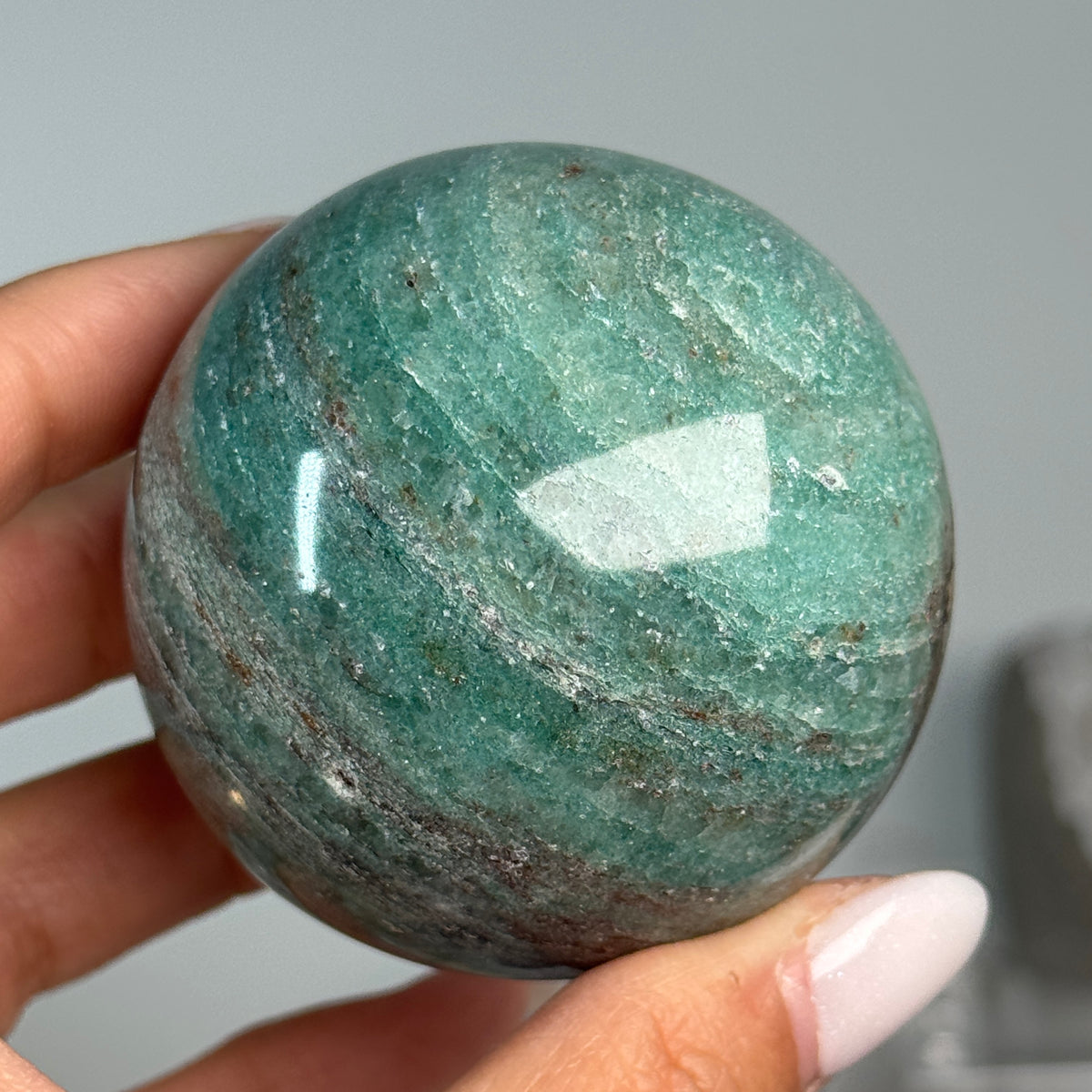 Teal Aventurine Sphere #7, alternate view showing green coloring with fine mottled patterns.
