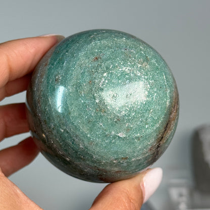 Teal Aventurine Sphere #7, alternate view showing green coloring with fine mottled patterns.