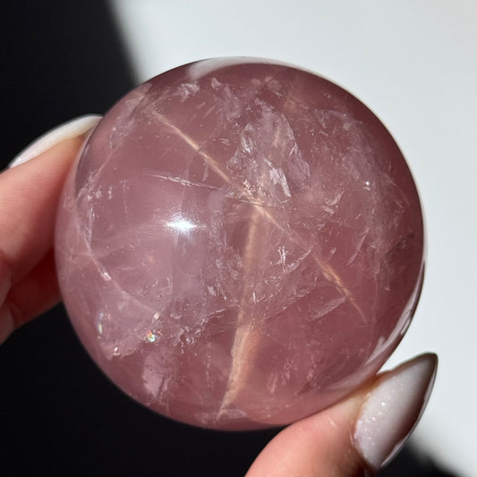 dark pink rose quartz sphere asterism crystals