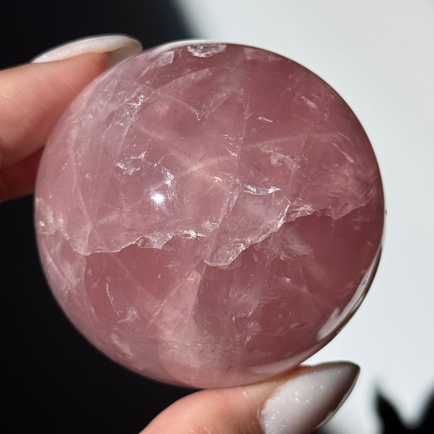 dark pink rose quartz sphere asterism crystals
