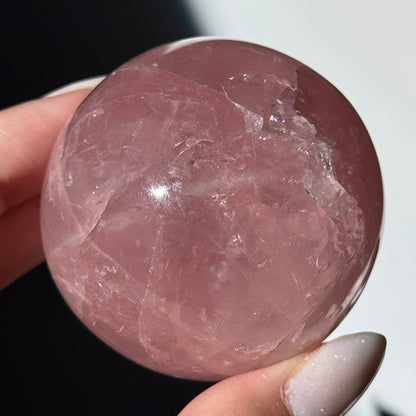 dark pink rose quartz sphere asterism crystals