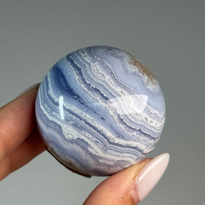 Blue Lace Agate Sphere #1, alternate view showing blue and white wavy bands.