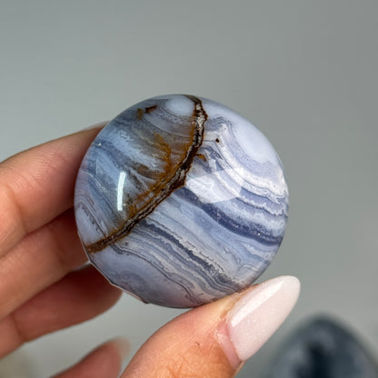 Blue Lace Agate Sphere #12, alternate view showing blue and white banding with a brown mineral seam.