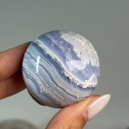 Blue Lace Agate Sphere #2, alternate view showing blue and white wavy bands.