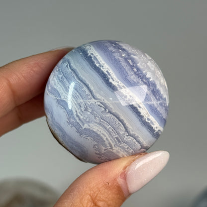 Blue Lace Agate Sphere #2, alternate view showing blue and white wavy bands.