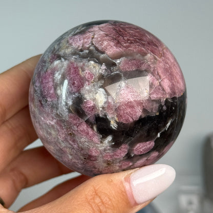 Rubellite (Pink Tourmaline) with Smoky Quartz Sphere #12, alternate view showing pink, black and cream mineral patterns.