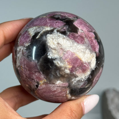 Rubellite (Pink Tourmaline) with Smoky Quartz Sphere #9, alternate view showing pink, black and cream mineral patterns.