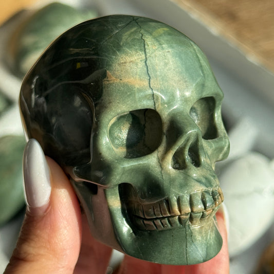 Skull Carving - Green Dragon Jasper #6, front view showing green coloring with cream and tan veining.