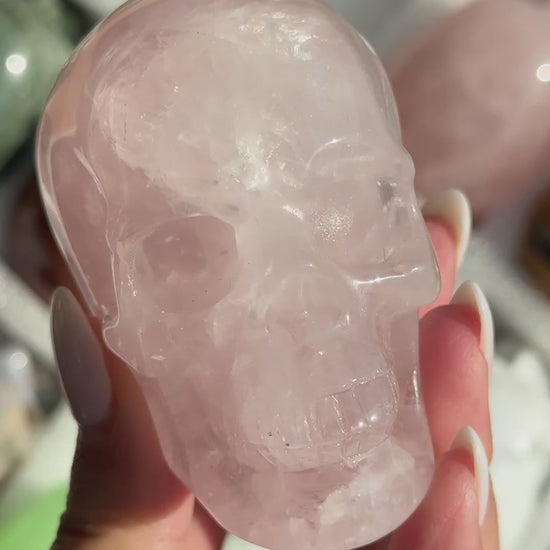 Video of Skull Carving - Rose Quartz #10, showing the carved details and translucent pale pink coloring.