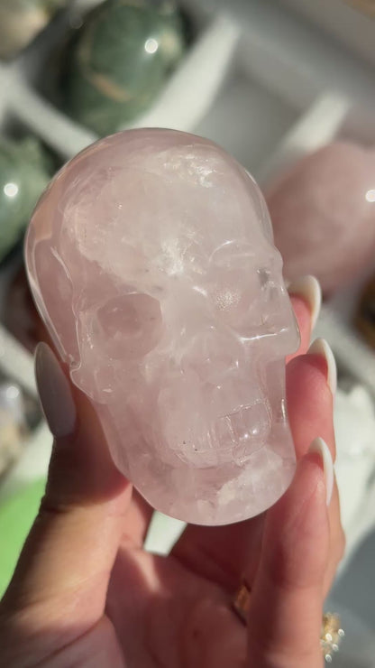 Video of Skull Carving - Rose Quartz #10, showing the carved details and translucent pale pink coloring.