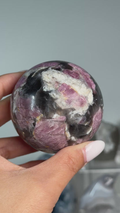 Video of Rubellite (Pink Tourmaline) with Smoky Quartz Sphere #9, showing pink, black and cream mineral patterns across the polished sphere.