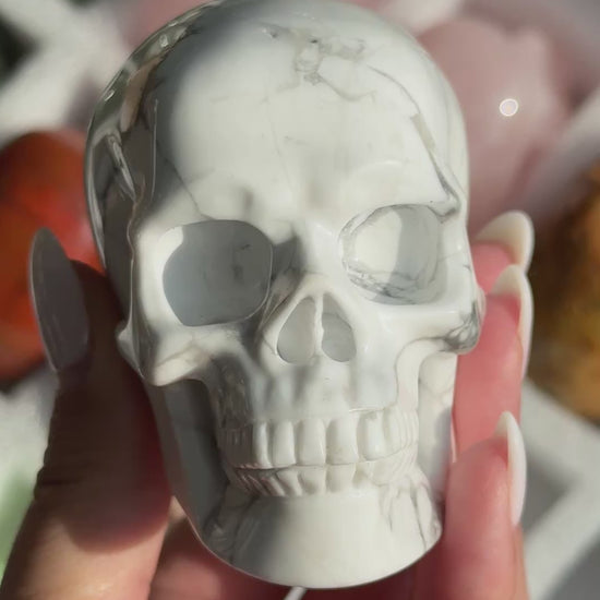 Video of Skull Carving - Howlite #17, showing the carved details and white coloring with gray branching veins.