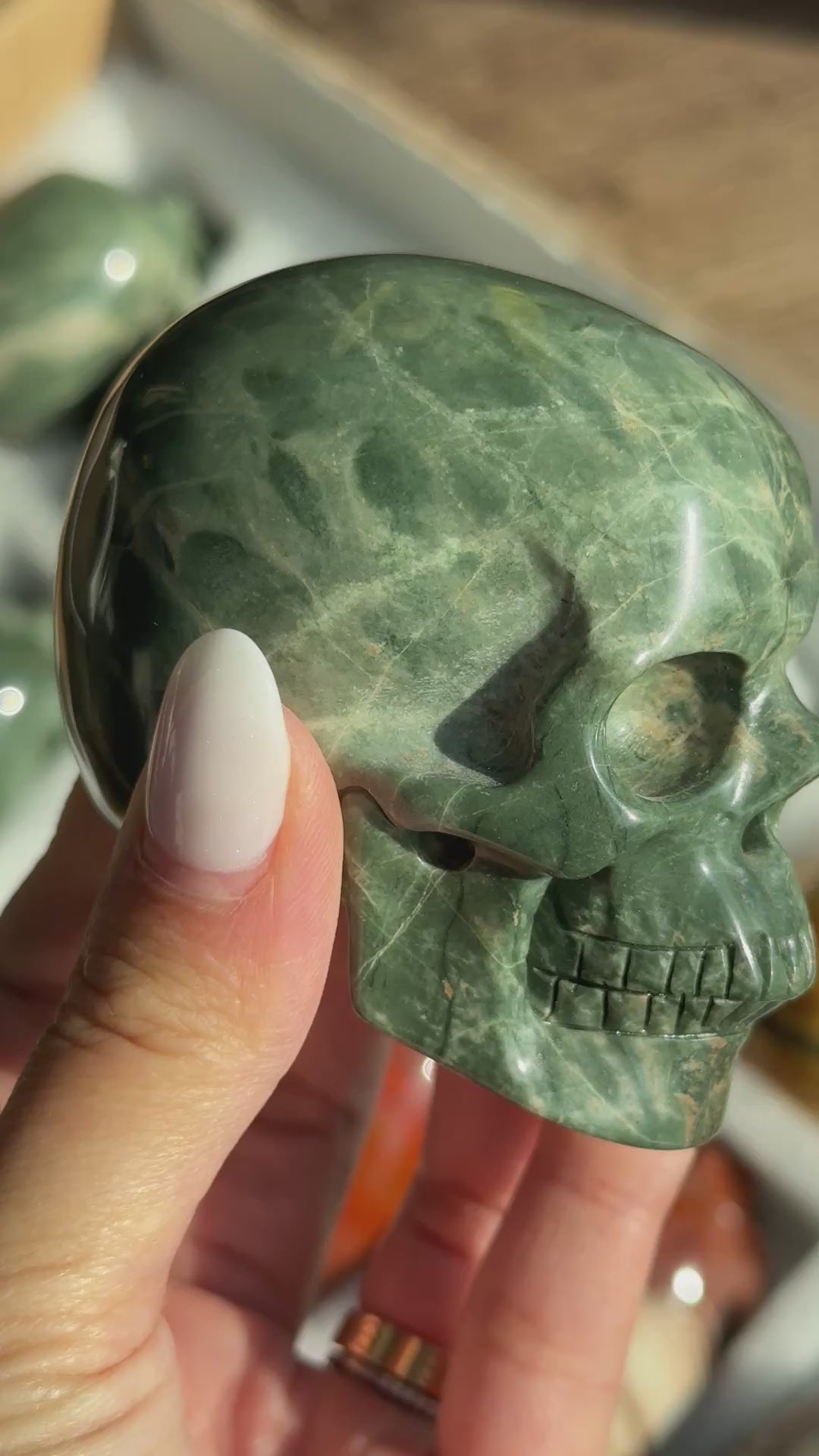 Video of Skull Carving - Green Dragon Jasper #7, showing the carved details and dark green and cream mottled patterns.