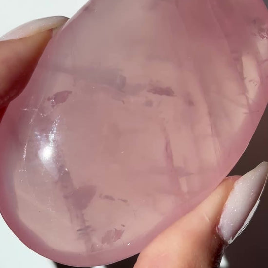 dark pink rose quartz palm asterism crystals