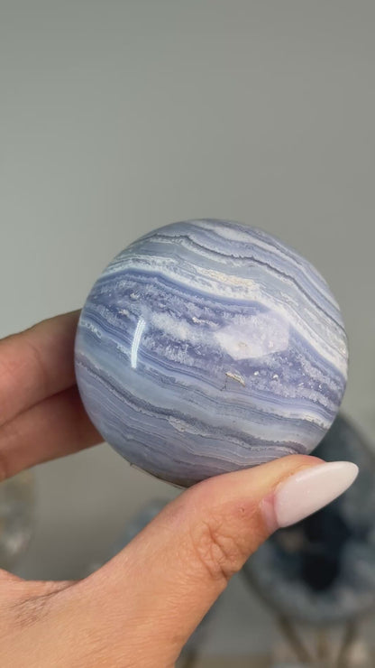 Video of Blue Lace Agate Sphere #4, showing fine blue and white layered bands across the polished sphere.