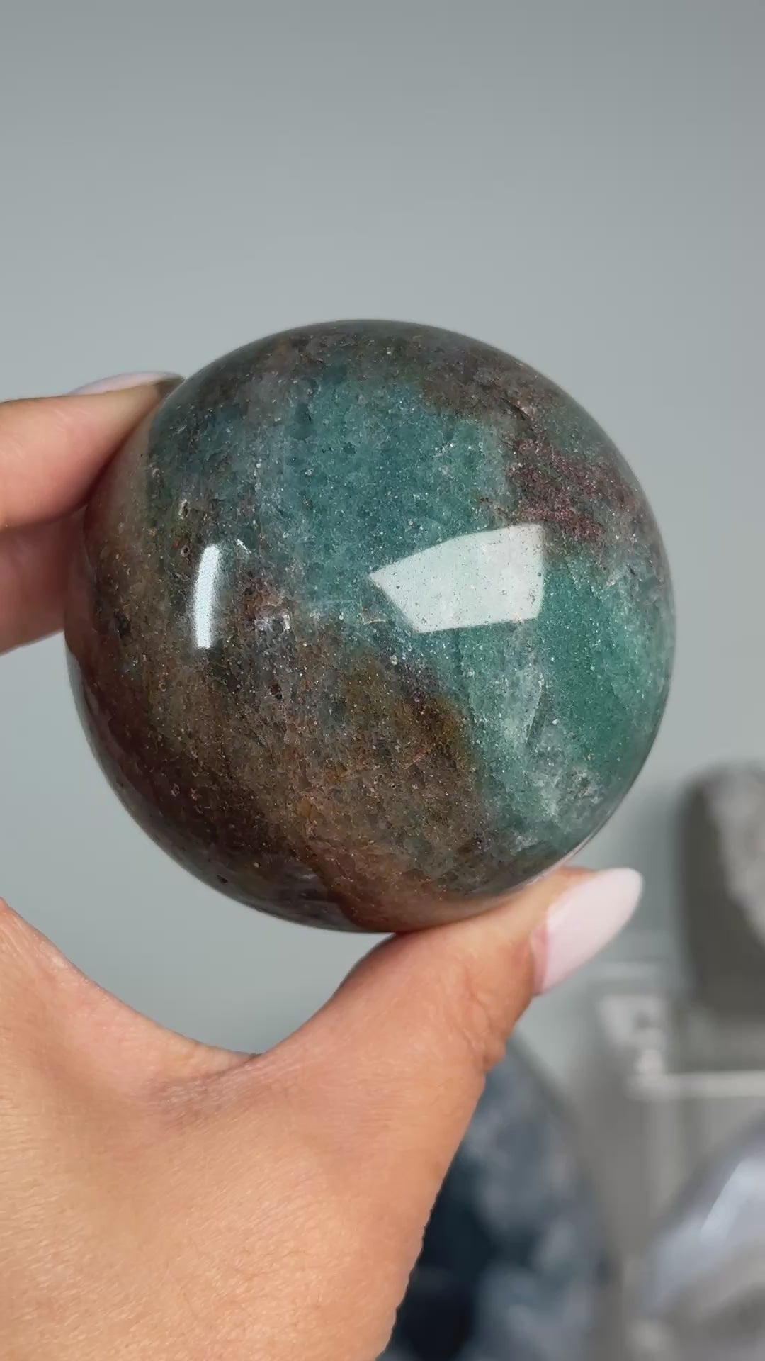 Video of Teal Aventurine Sphere #6, showing teal-green and brown mottled patterns across the polished sphere.
