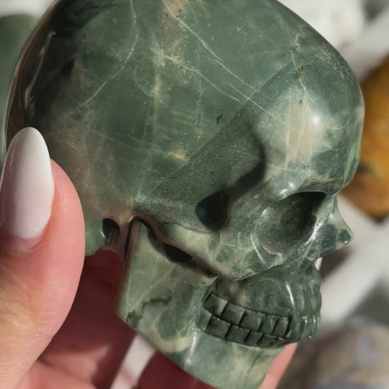 Video of Skull Carving - Green Dragon Jasper #2, showing the carved details and deep green coloring with pale mineral patches.