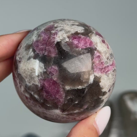 Video of Rubellite (Pink Tourmaline) with Smoky Quartz Sphere #5, showing pink, black and cream mineral patterns across the polished sphere.