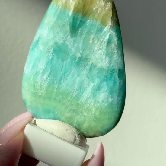 polished blue green brucite freeform