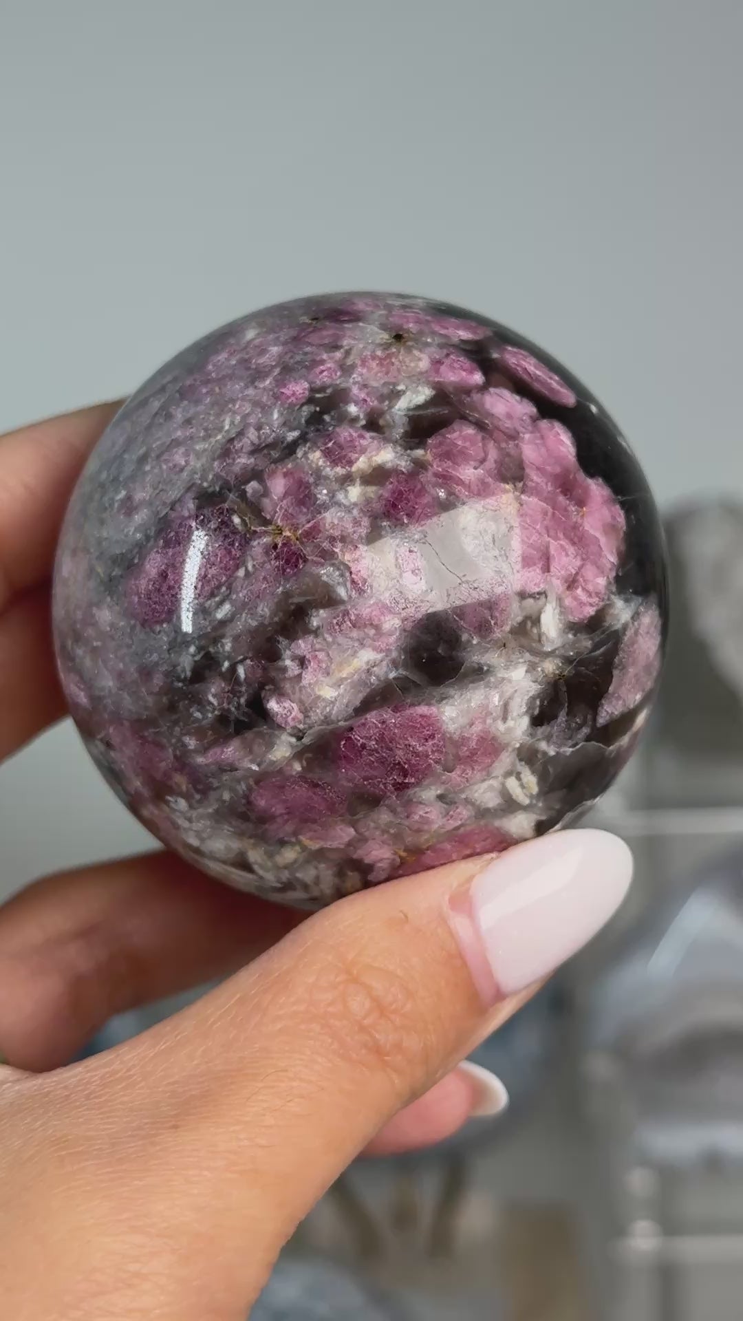 Video of Rubellite (Pink Tourmaline) with Smoky Quartz Sphere #12, showing pink, black and cream mineral patterns across the polished sphere.